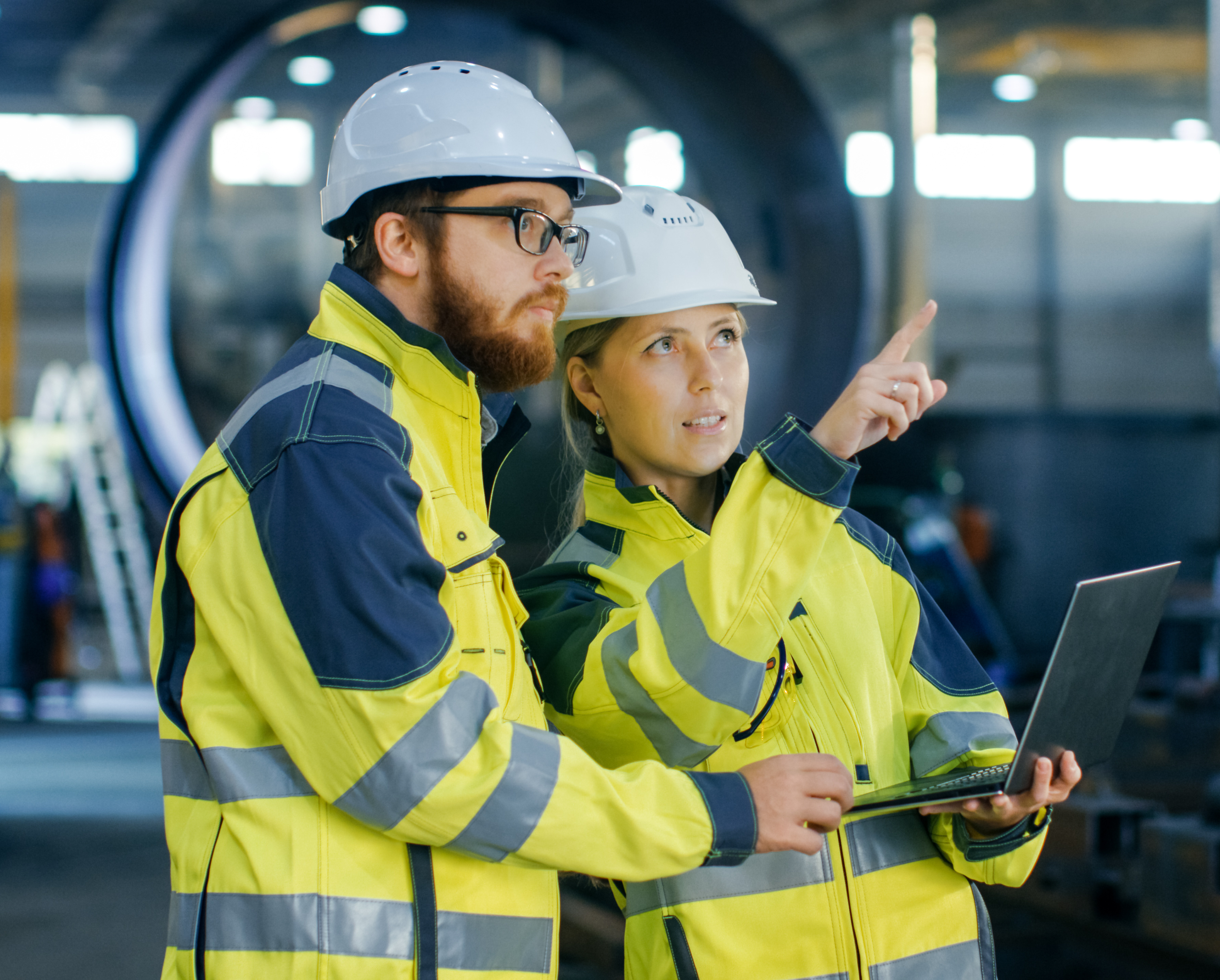 Industrial workers coordinating and planning workplace safety initiatives